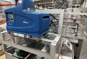 Carton forming and Nordson Problue hot melt glue unit.