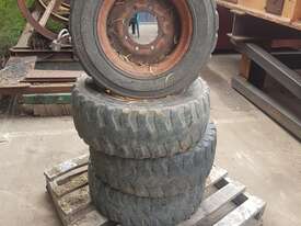 4 x Tyre and rims to suit New Holland LS140 Skid Steer 6 month warranty - picture0' - Click to enlarge