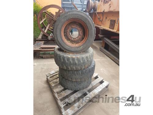 4 x Tyre and rims to suit New Holland LS140 Skid Steer 6 month warranty