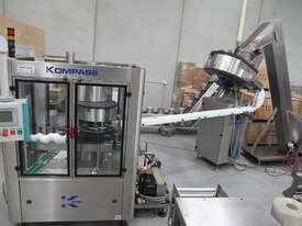 Continuous Plastic Lid Press Capping Machine - picture1' - Click to enlarge