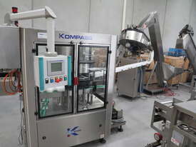 Continuous Plastic Lid Press Capping Machine - picture0' - Click to enlarge