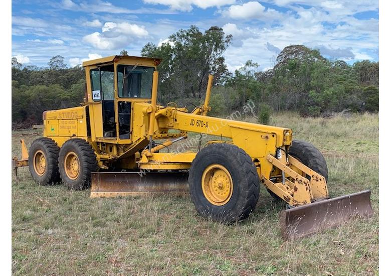 caption 1979 John Deere 670A Grader *CONDITIONS APPLY*