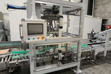 Glass jar filling and packing system, carton erector, carton sealing machine and filling machine.