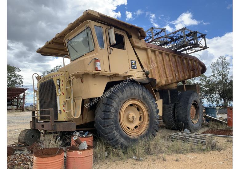 caption 1980 Caterpillar 773 dump truck