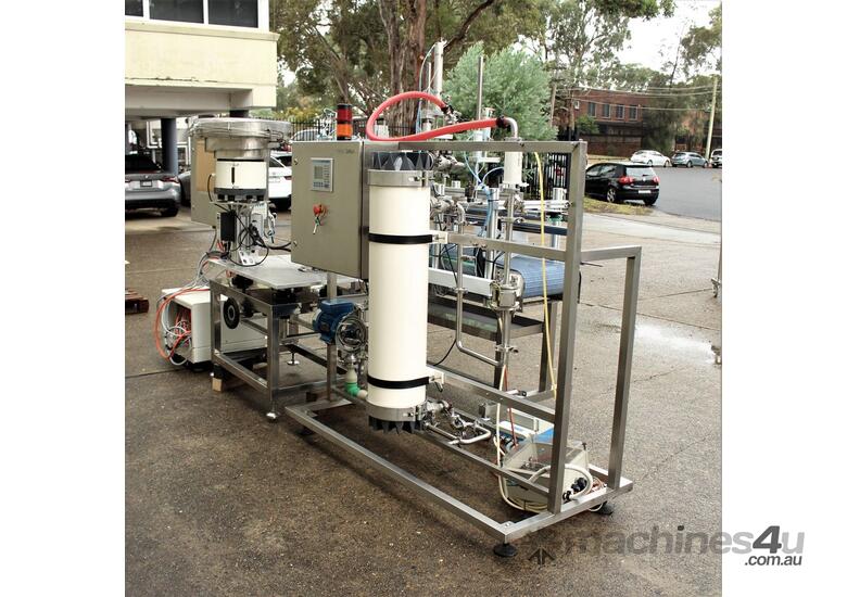 caption Liquid Filling and Capping Machine using Flowmeter with Inline Filter.