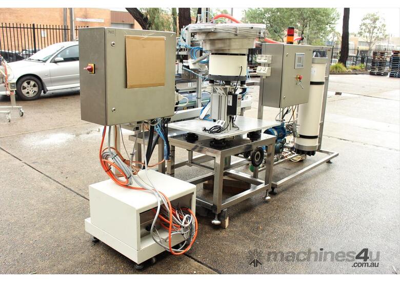 caption Liquid Filling and Capping Machine using Flowmeter with Inline Filter.