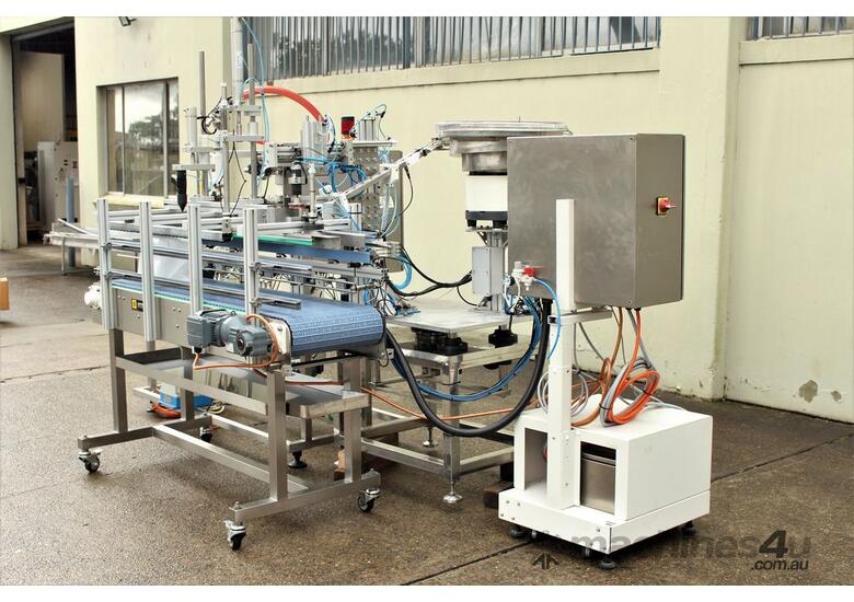 caption Liquid Filling and Capping Machine using Flowmeter with Inline Filter.