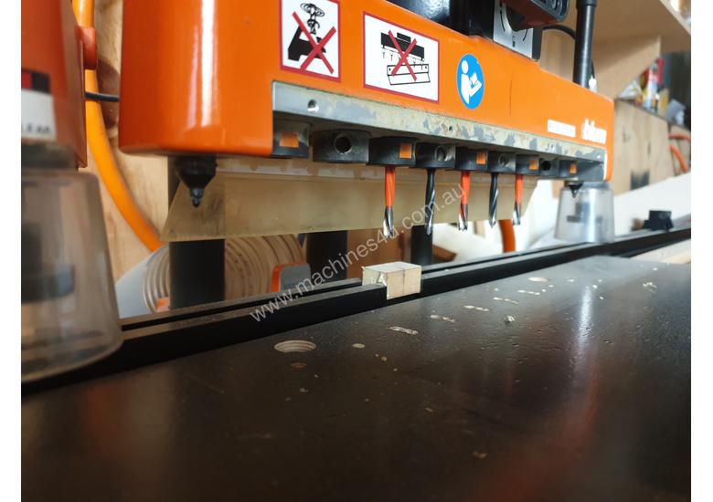caption Cabinet making machine Blum mini press and drill press