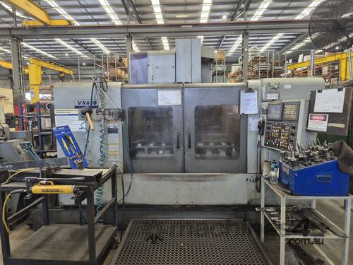 caption Used VX650 Hyundai CNC Machine - Fanuc Control for sale