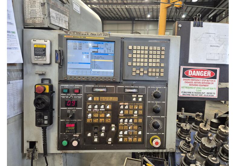 caption Used VX650 Hyundai CNC Machine - Fanuc Control for sale