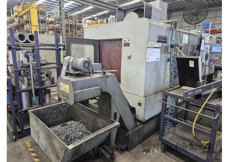 caption Used VX650 Hyundai CNC Machine - Fanuc Control for sale