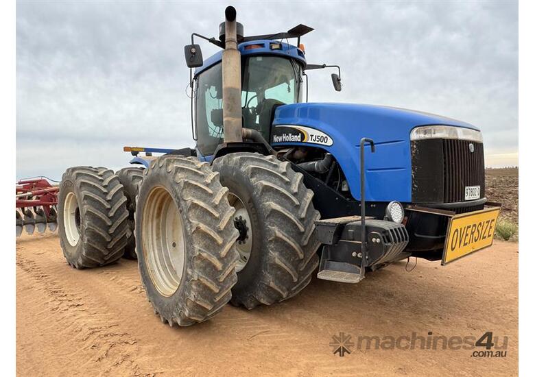 caption NEW HOLLAND TJ500 TRACTOR