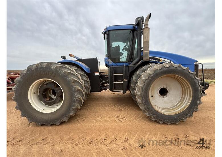 caption NEW HOLLAND TJ500 TRACTOR