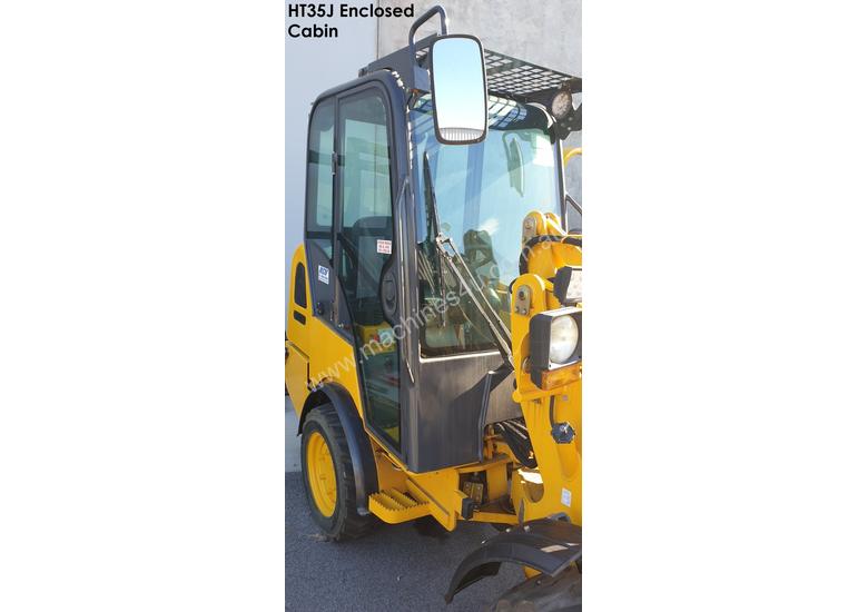 caption UNUSED HT35J Articulated Mini Wheel Loader with Perkins Engine complete with GP Bucket & Pallet Fork