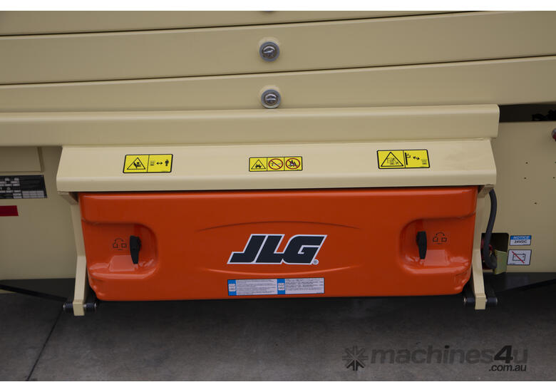 caption JLG 32ft Electric Scissor Lift – Powerful, Compact & Ideal for Your Indoor Projects! For Hire!
