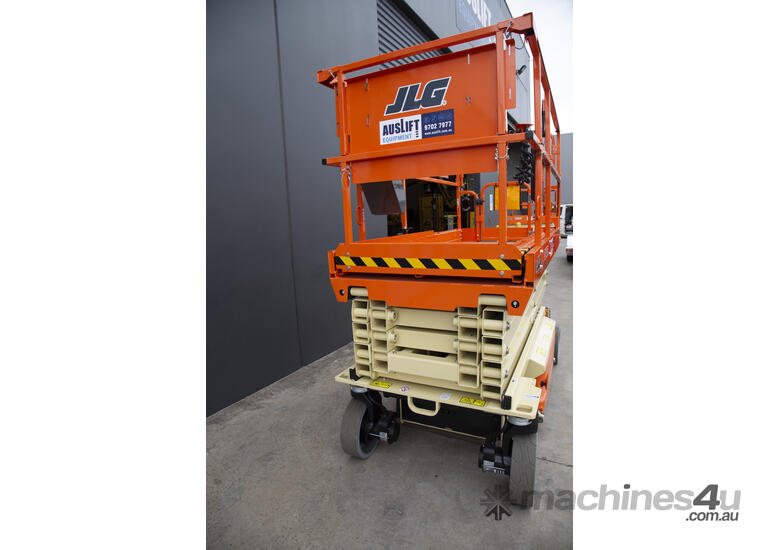 caption JLG 32ft Electric Scissor Lift – Powerful, Compact & Ideal for Your Indoor Projects! For Hire!