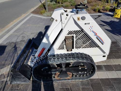 Ramrod 915 stand behind skid steer.