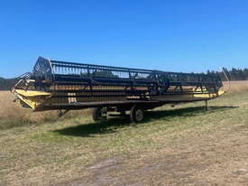 New Holland TR98 Harvester + Honey Bee 994 Front Header Combo - picture0' - Click to enlarge