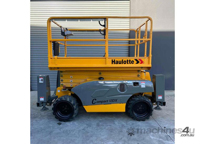 caption Haulotte Compact 12DX - 32ft Rough Terrain Scissor Lift
