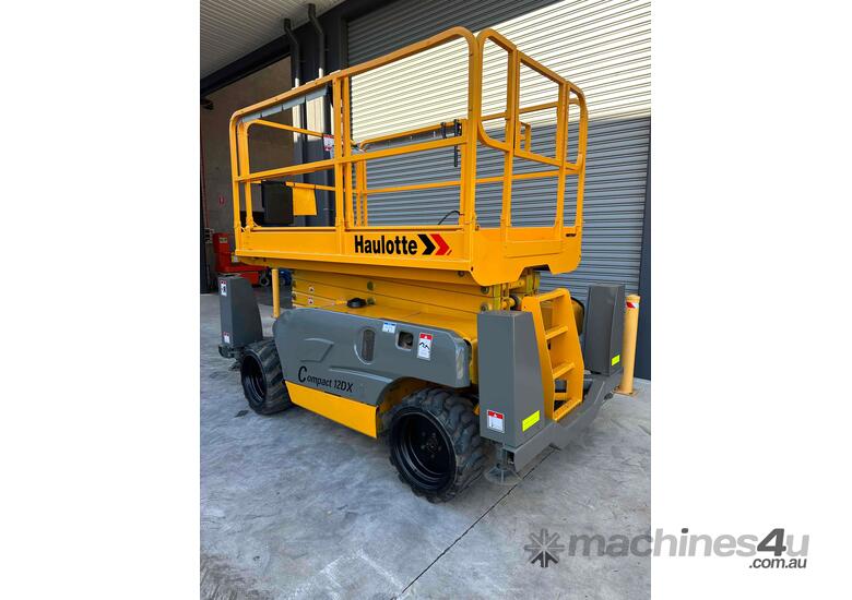 caption Haulotte Compact 12DX - 32ft Rough Terrain Scissor Lift