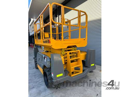 caption Haulotte Compact 12DX - 32ft Rough Terrain Scissor Lift