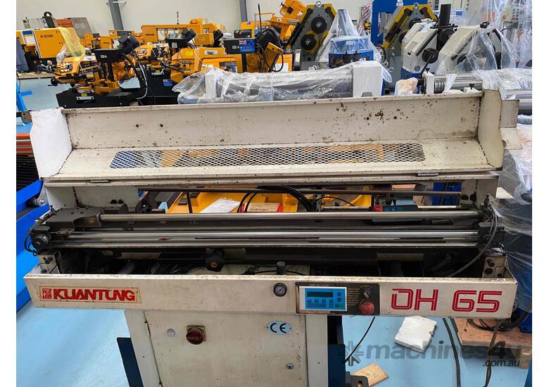 caption Fedek DH-65 CNC bar feeder