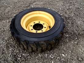 CATERPILLAR SOLID FILLED 226B3 8 STUD RIM TYRE Tyre/Rim Combined Tyre/Rim - picture0' - Click to enlarge