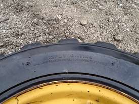 CATERPILLAR SOLID FILLED 226B3 8 STUD RIM TYRE Tyre/Rim Combined Tyre/Rim - picture2' - Click to enlarge