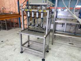 4-head semi-automatic liquid filler - picture0' - Click to enlarge