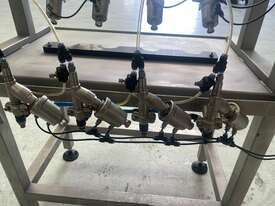 4-head semi-automatic liquid filler - picture1' - Click to enlarge