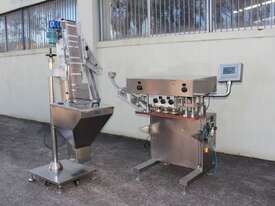 Automatic Spindle Inline Capper with Feeding Elevator. - picture0' - Click to enlarge