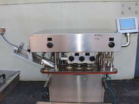 Automatic Spindle Inline Capper with Feeding Elevator. - picture1' - Click to enlarge