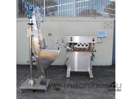 Automatic Spindle Inline Capper with Feeding Elevator.