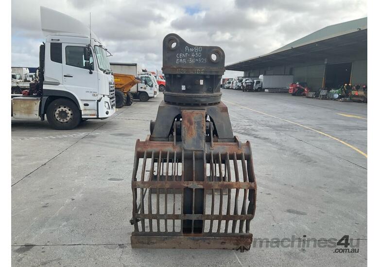 caption JCB Rotating Grab Attachment