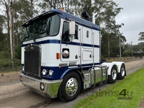 2003 Kenworth K104 flat roof, Cummins Signature 520hp, 18sp manual
