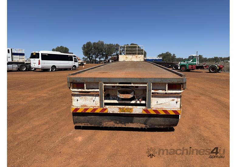 caption 1985 Fruehauf 45ft Flat Deck Tri-Axle