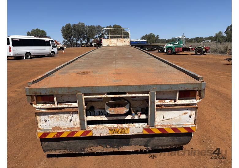 caption 1985 Fruehauf 45ft Flat Deck Tri-Axle