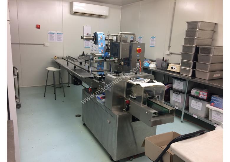 caption Flamingo Stainless Steel Horizontal Flow Wrapper Packing Machine + Anser U2 Pro-S label/date printer