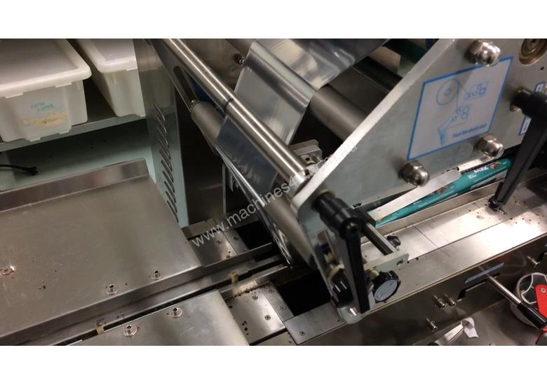caption Flamingo Stainless Steel Horizontal Flow Wrapper Packing Machine + Anser U2 Pro-S label/date printer