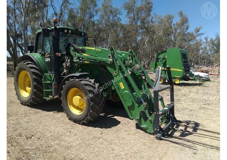 caption John Deere 6140m With FEL
