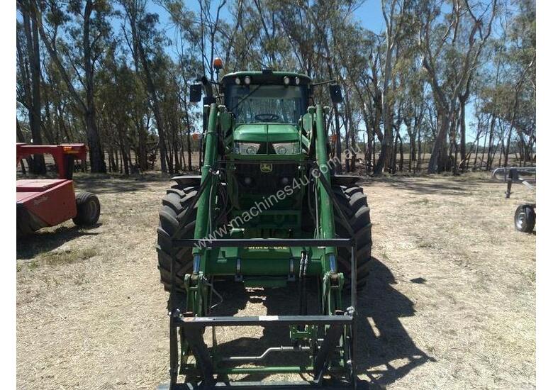 caption John Deere 6140m With FEL