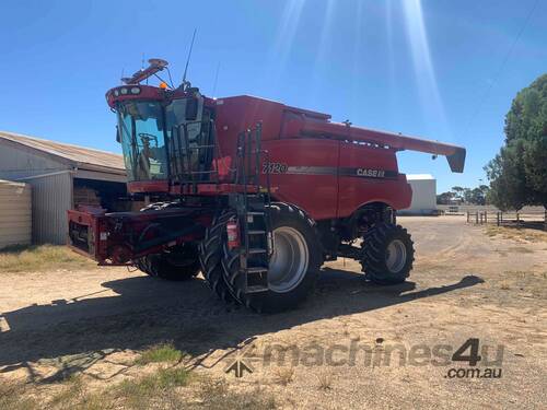 Case IH 7120 on duals with 35 foot Case front on trailer and 16 foot Case 3016 pickup