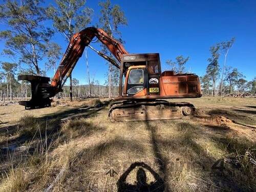 caption 2002 DAEWOO 290LC-V BUNCHER WITH PULPMATE HEAD