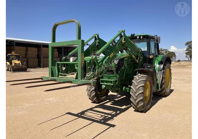 caption John Deere 6140m With FEL