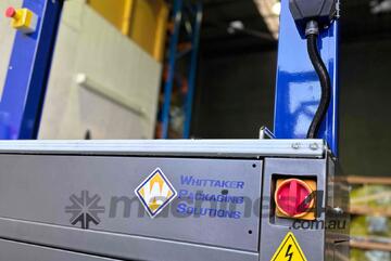 WHITTAKER PACKAGING - High Speed Automatic Strapping Machine