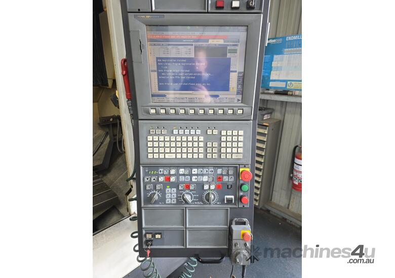 2015 OKUMA GENOS M560R-V MACHINING CENTRE WITH TRX320 ROTARY TABLE