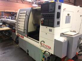 Quick Tech GT4 CNC production lathe with barfeed - picture0' - Click to enlarge