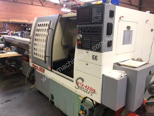 Quick Tech GT4 CNC production lathe with barfeed