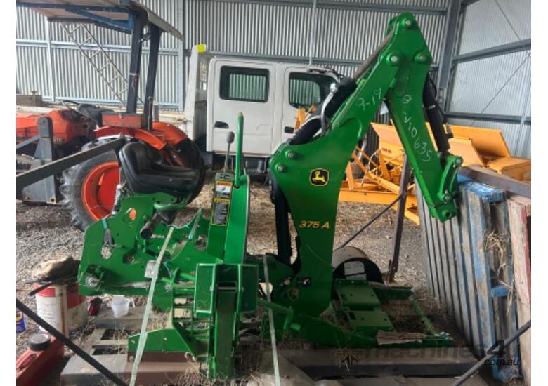 caption John Deere 375A Backhoe attachment