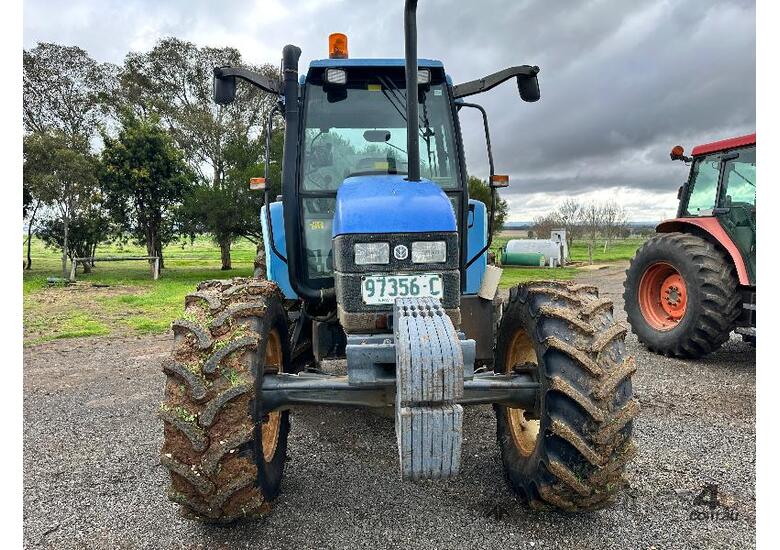 caption NEW HOLLAND TS90 4WD TRACTOR.